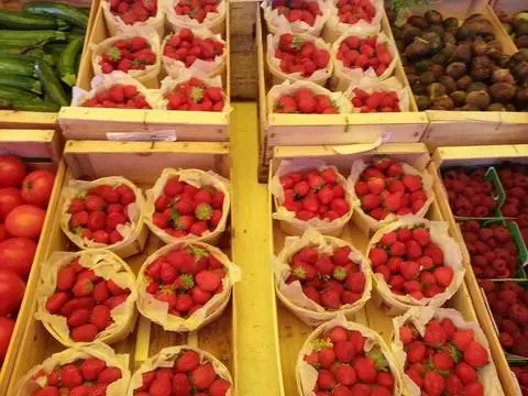 Baskets of strawberries at a market in Provence, France.