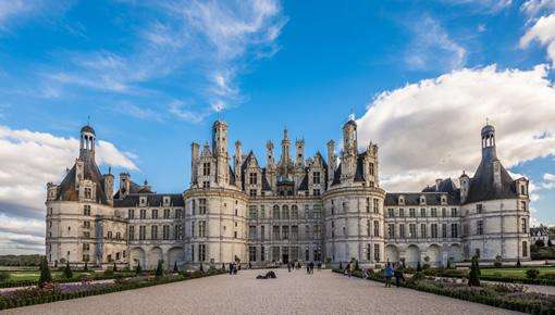Two Loire Castles plus Wine Cave Tour: Visitors approach the historic Chambord castle in the Loire Valley.