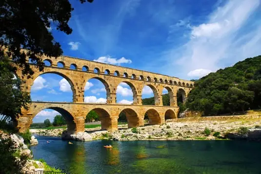 A view of the Pont du Gard in France from the river below.