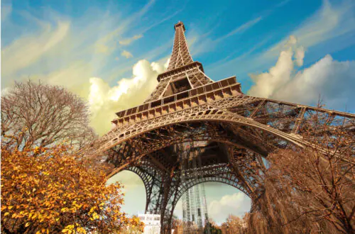 The Eiffel Tower against a blue Paris sky