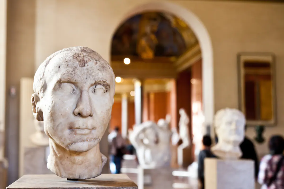 Marble statue heads in the Louvre Museum in Paris.
