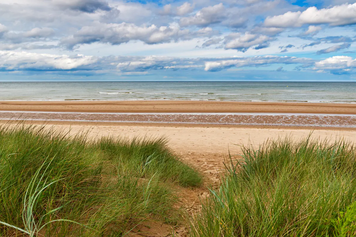 A contemporary view of Omaha beach looking serene and calm.
