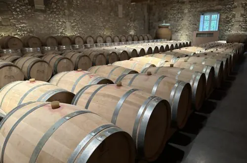 Wine barrels aging in a Bordeaux cellar