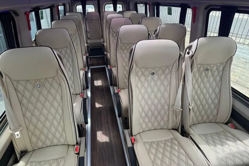 The interior of a 22 seat Mercedes Sprinter van. Available for transfers to or from Paris.