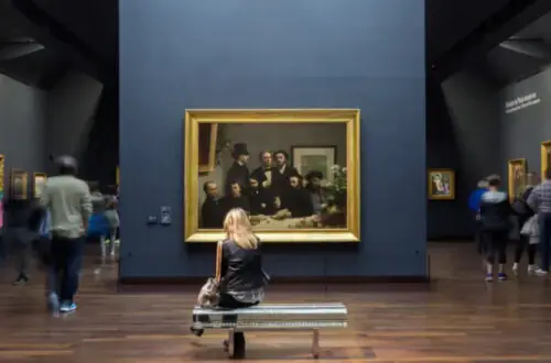 Visitors admiring Impressionist masterpieces at Musée d'Orsay in Paris