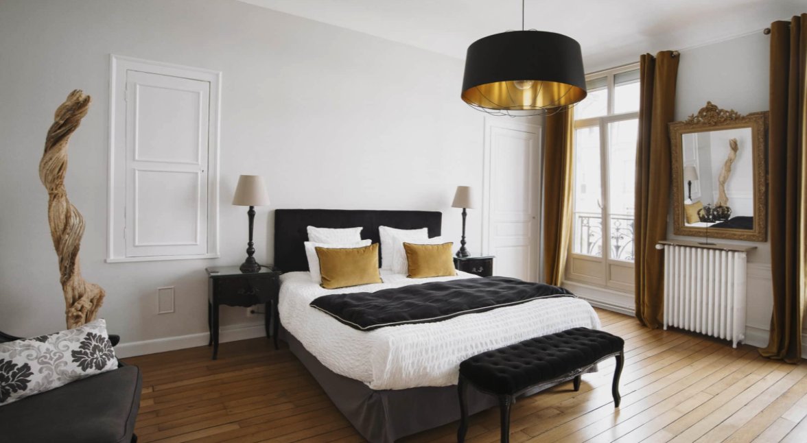 Bedroom at La Demeure des Sacres guesthouse in Reims, France.