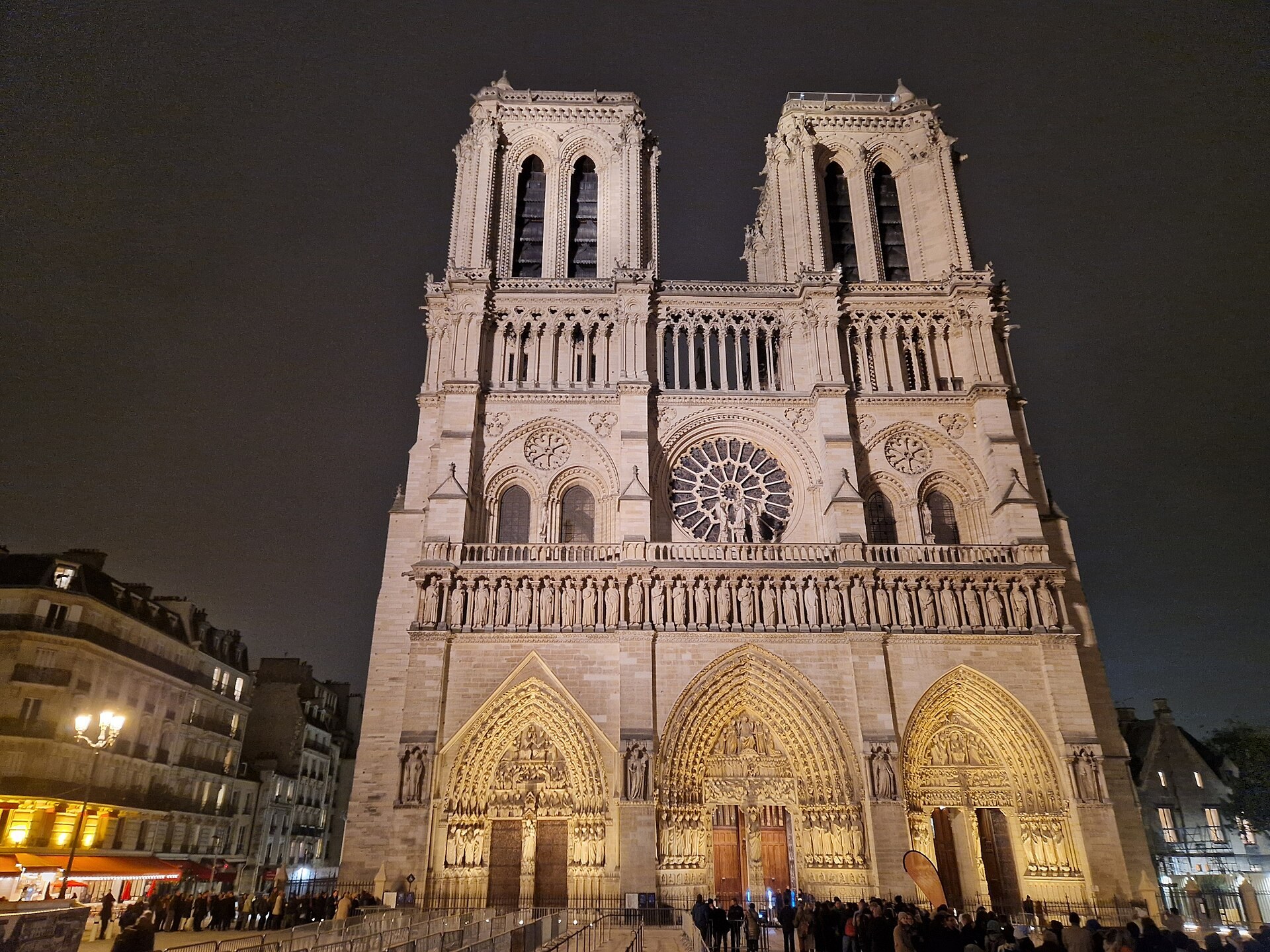 The west front of Notre-Dame de Paris lit at night