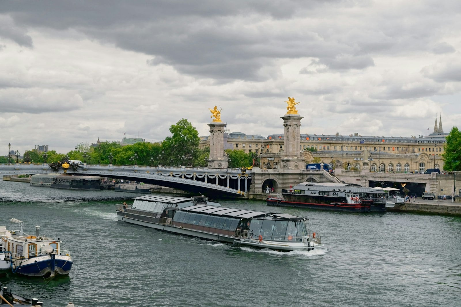 A sightseeing boat on the Seine by the Pont Alexandre III