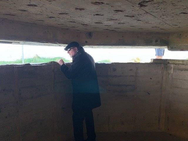 A tour guest Inside a German pillbox